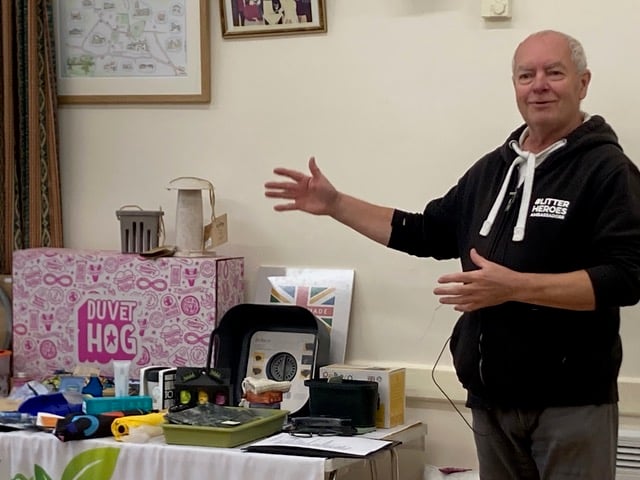 Keith Hunt, of Our Precious Earth, shows Carhampton Climate Group examples of plastic-free and recycled items.