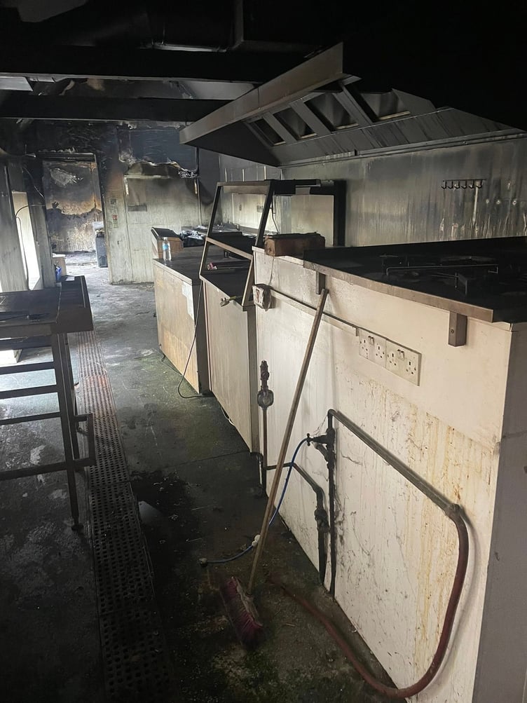 The blackened inside of Reeves restaurant, Dunster, after a devastating fire.