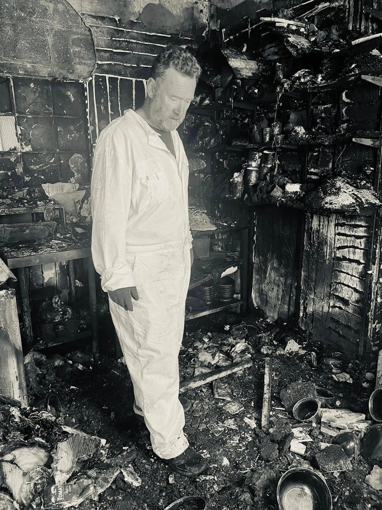 Justin Reeves surveys the damage to his Dunster restaurant.