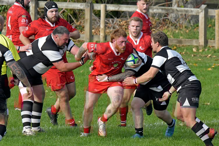 Minehead Barbarians (black and white hoops) in action against Rebels
