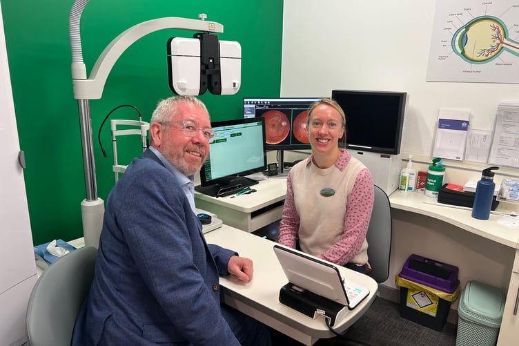 Specsavers Minehead owner Paul Bradford with one of the store's new directors Cassie Simmonds.