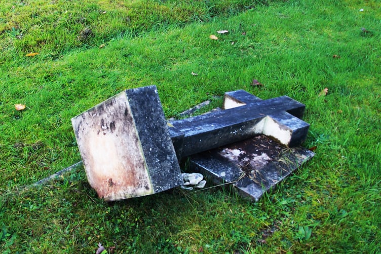 One of the memorial crosses in Porlock Cemetery tipped over for safety reasons by contractors. PHOTO: George Ody.