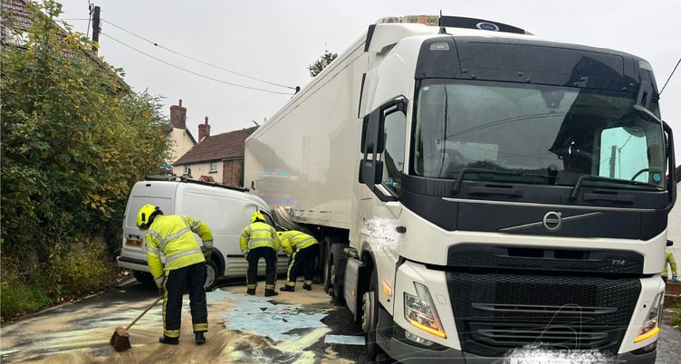 Firefighters clear up after a crash in Washford closed the A39 on Tuesday.