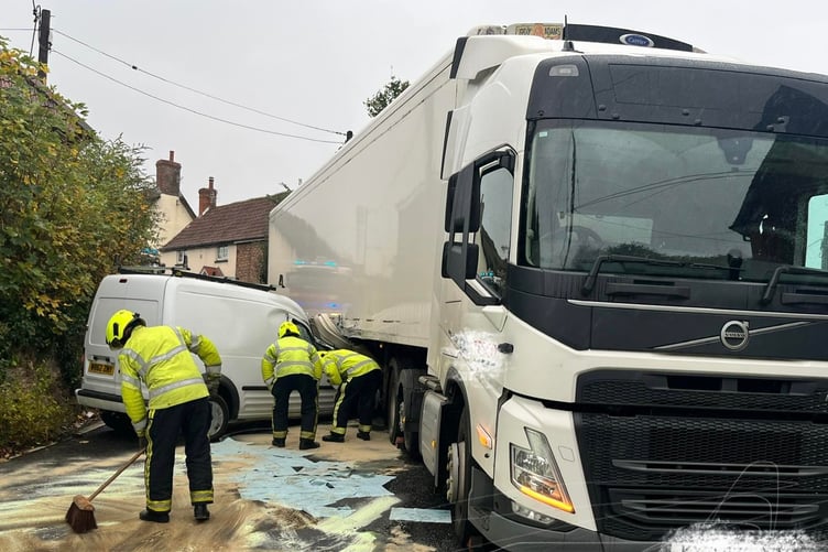 Firefighters clear up after a crash in Washford closed the A39 on Tuesday.