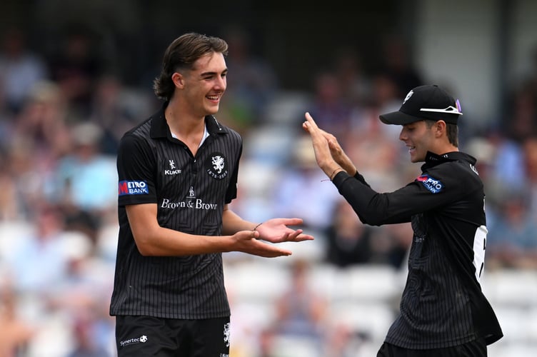 JT Langridge (left) celebrating a wicket with Archie Vaughan  