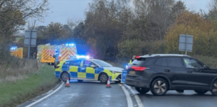 Driver rescued from car in water-filled ditch