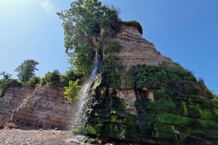 The famed waterfall on St Audries beach lies on the route of the 80 miles in eight days challenge.