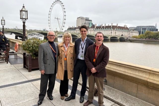 Thomas Greenwell (right) and his father Roger (left) being shown around the House of Commons.
