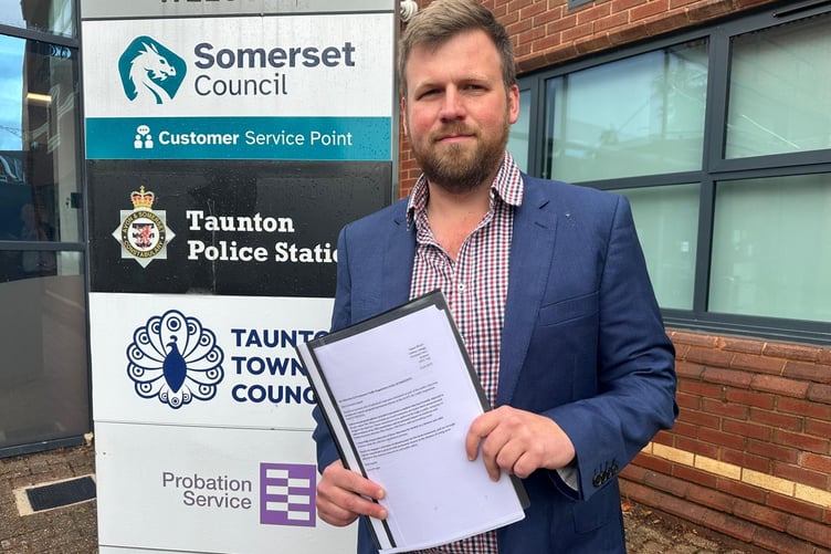 Campaigner James Wright delivering his letter to Somerset Council with more than 1,000 signatures opposing the closure of the B3191.