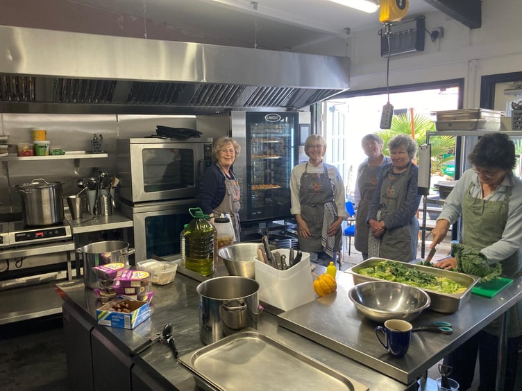 Some of the Wivey Kitchen charity chefs in the kitchen provided by the Bear Inn, Wiveliscombe.