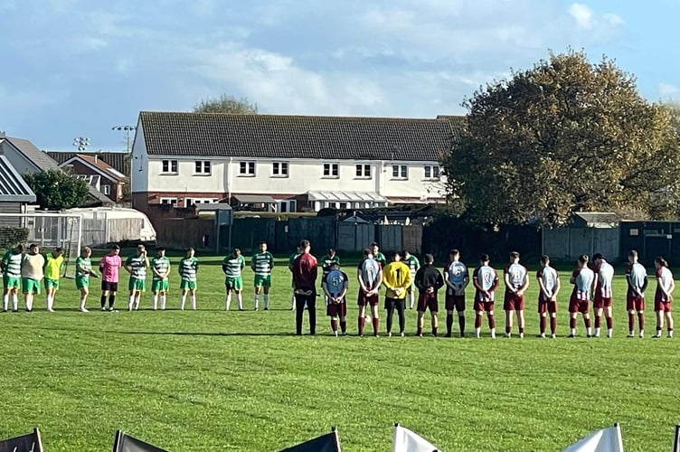 Alcombe and Racehorse players hold a minute's silence to honour those who gave their lives in conflicts over the years.
