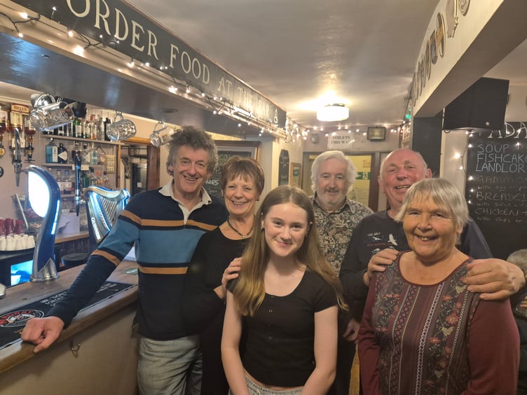 The winning pub quiz team The Fab Four in Watchet's bell inn, with landlord Paul Taplin at the rear.