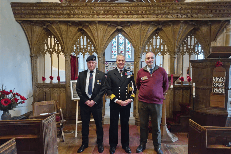 Rear Admiral Ian Moncrieff (centre) delivered the reflection during a service of Remembrance in St Petrock's Church, Timberscombe.