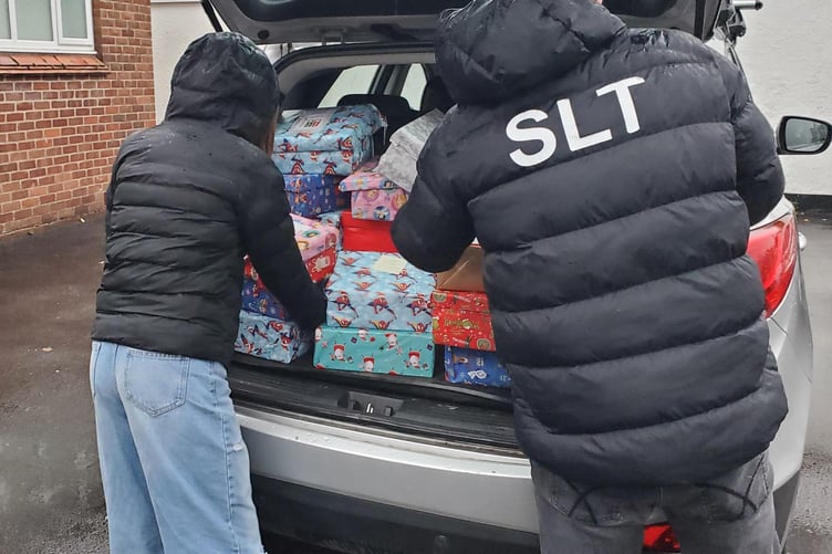 Minehead Middle School charity Christmas shoeboxes being delivered to Millbridge Evangelical Church.