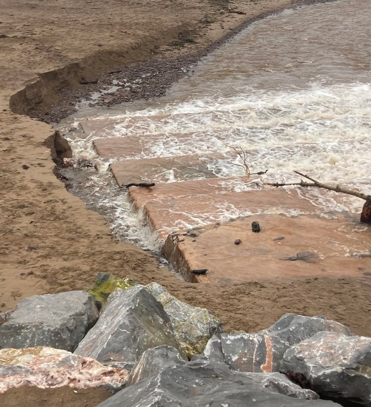 Geoff Broome took this photograph showing part of Dunster Beach had been swept away by Storm Claudia.