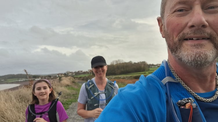 Darcey Curran training with mother Jack and father Mark for her charity fund-raising Bridgwater to Taunton canal run.