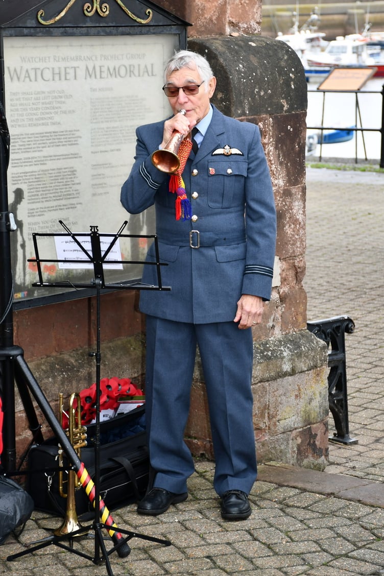 Bugler Alan Radford plays 'Last Post' at Watchet War Memorial.