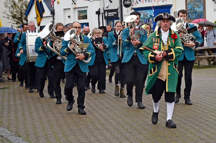 Town crier Dave Milton and West Somerset Brass led a 300-strong Remembrance parade in Watchet.