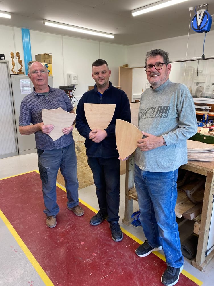Members of Minehead Shed have made shields which Dunster schoolchildren will decorate for the village's winter festival.