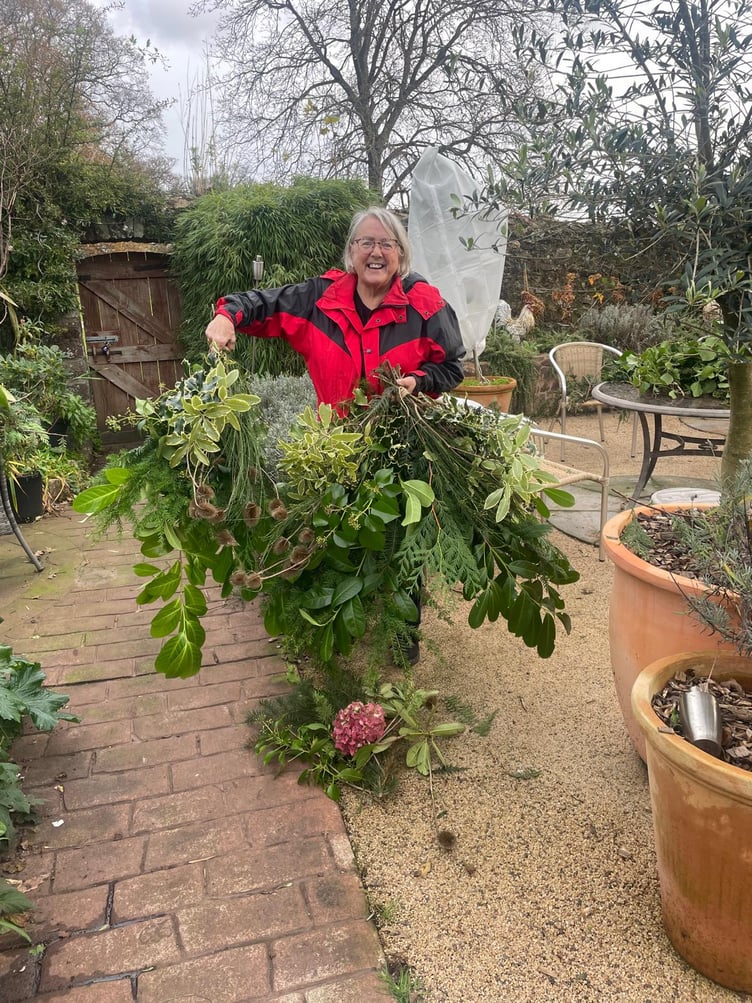 Claire Reeves prepares natural foliage for decorating Dunster for this year's winter festival.