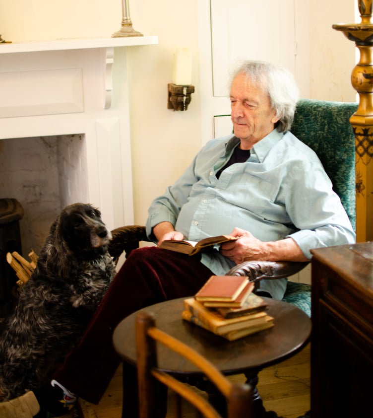 The late Nick Cotton in his Watchet home with his dog Ollie