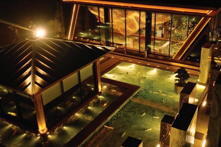 George Singer's 'Lua' light installation can be seen through the windows of this Vietnam house.