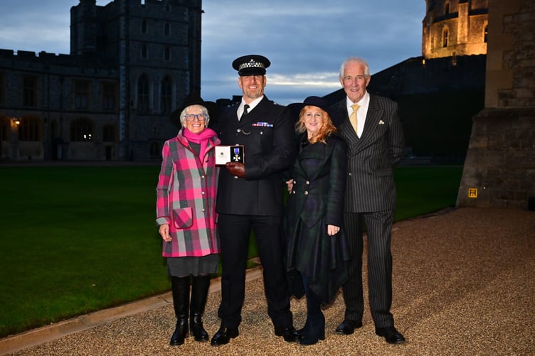 Chief Insp Chris Conrad is pictured with his Royal Victorian Order at Windsor Castle with (left to right) his mother Liz Bennett, his wife Debs, and his father Peter Conrad.