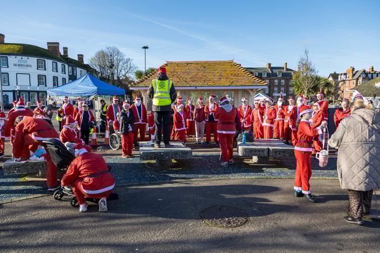 Some of the Santa fun runners who took part in Minehead Rotary's annual sea front event this year.