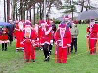 Santas brave weather for town's first fun run