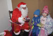 Santa makes a seaborne entrance as Watchet crowds enjoy late night festive fun