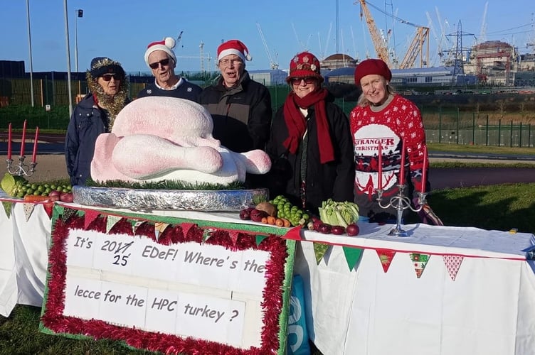 A Christmas protest by Stop Hinkley members (left to right) Katy Attwater, Roy Pumfrey, Allan Jeffery, Jo Smoldon, and Sue Aubrey.