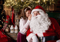 Lions club helping Santa as he visits three supermarkets in Minehead to meet children