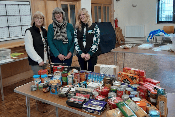 West Somerset Food Cupboard volunteers with some of the donations going into this year's Christmas emergency food parcels.