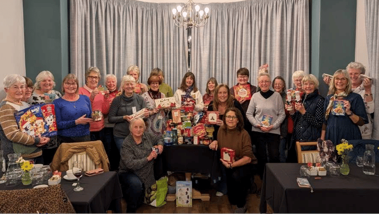 West Somerset Food Cupboard volunteers meet members of Minehead Women's Institute.