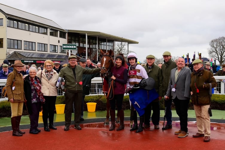 Kap Vert in the winners enclosure at Taunton with jockey Sean Houlihan, joint trainer Johnson White (third from right) and winning connections,