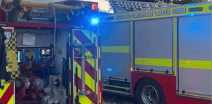 One trapped as two cars collide