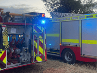 One trapped as two cars collide