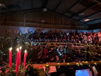 Farming families sing in auction ring