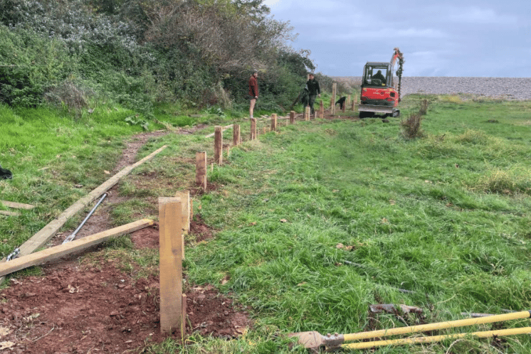 A new accessible boardwalk for Porlock Marshes is shown under construction.