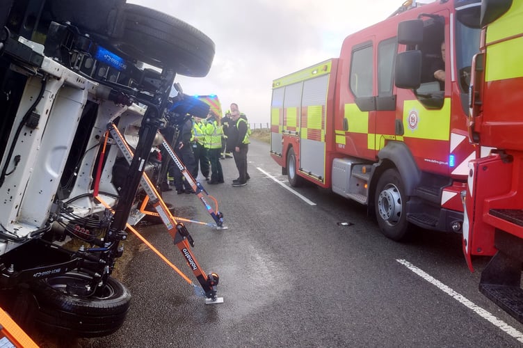Minehead and Lynton firefighters help rescue two men trapped in a Luton-type van overturned by Storm Bram winds on the A39 crossing Exmoor.