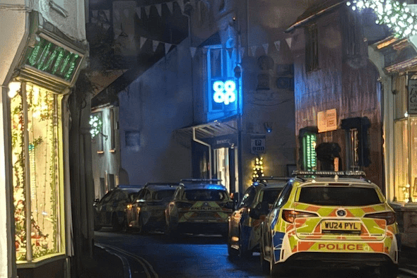 Five police cars can be seen outside a Co-op store in Watchet after trouble caused by youngsters in early December.