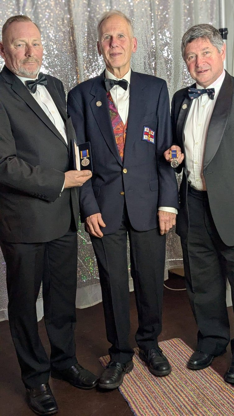Phil Horne and Paul Marsh are pictured with Minehead lifeboat operations manager John Higgie.