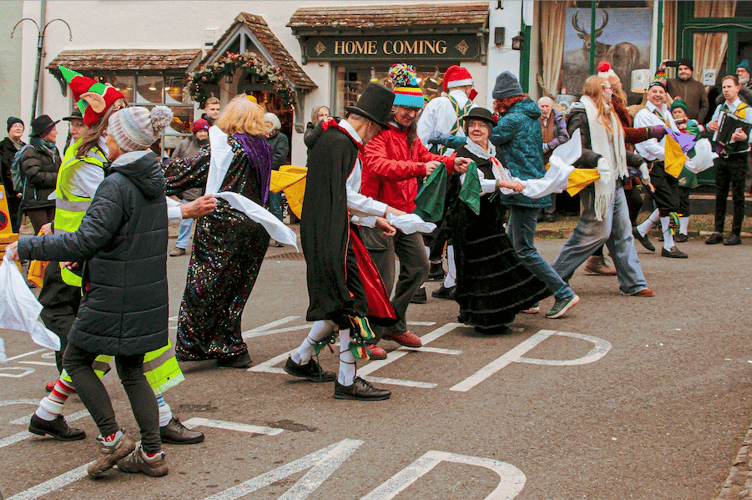 Spectators join in a West Somerset Morris performance in Dunster on Boxing Day.