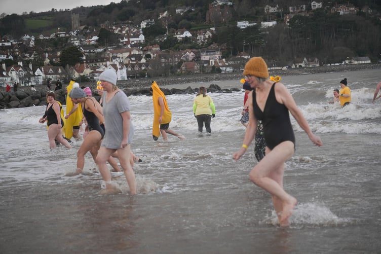 Some of the New Year's Day dippers who raised money for St Margaret's Hospice by plunging into the icy cold sea on Minehead beach.