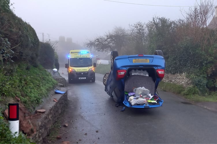 An ambulance arrives at the scene of a single-vehicle accident in Blue Anchor on Monday morning.