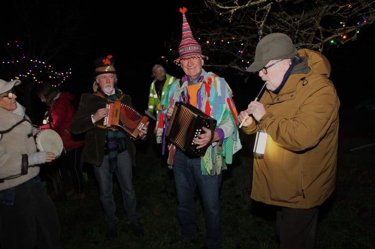 Making music for Carhampton's traditional wassail are Donald McCombie, Brian Heaton, and Graeme Horn. PHOTO: George Ody.