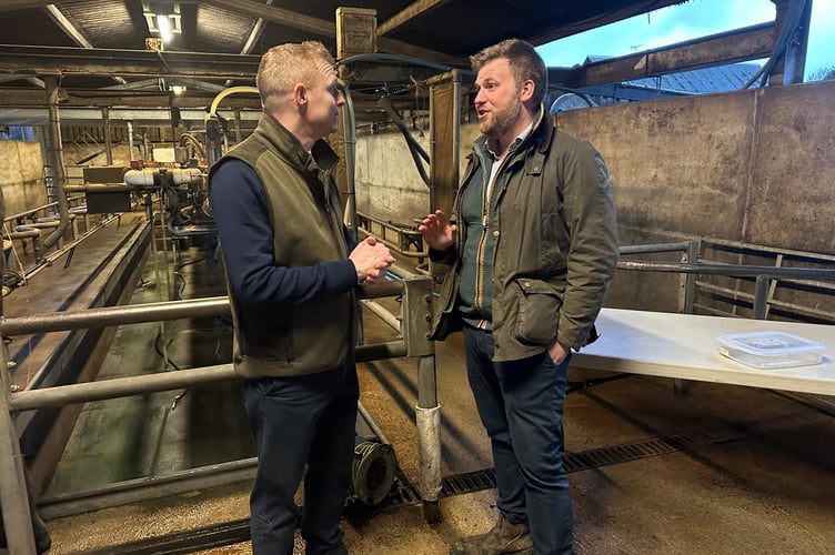 Exmoor farmer and political campaigner James Wright (right) speaking with Shadow Farming Minister Robbie Moore.