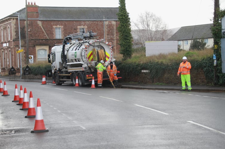 Drains being unblocked in Williton on Tuesday morning as the village was hit by overnight flooding.