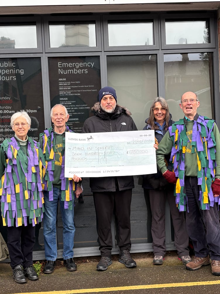 West Somerset Morris presents a cheque to MIND.