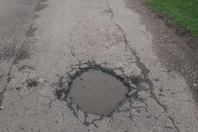 The extra cost of repairing roads in Somerset after Storm Chandra is being highlighted to the Government.